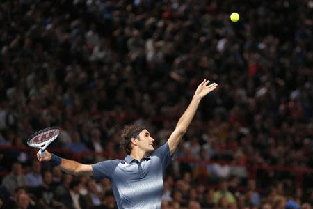 Roger Federer of Switzerland serves to Juan Martin Del Potro of Argentina in their quarterfinals match at the Paris Masters men's singles tennis tournament at the Palais Omnisports of Bercy in Paris, November 1, 2013. REUTERS/Charles Platiau