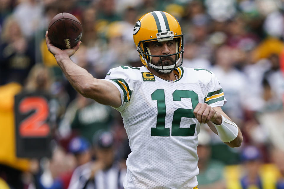 Green Bay Packers quarterback Aaron Rodgers throws the ball during the first half of an NFL football game against the Washington Commanders, Sunday, Oct. 23, 2022, in Landover, Md. (AP Photo/Susan Walsh)