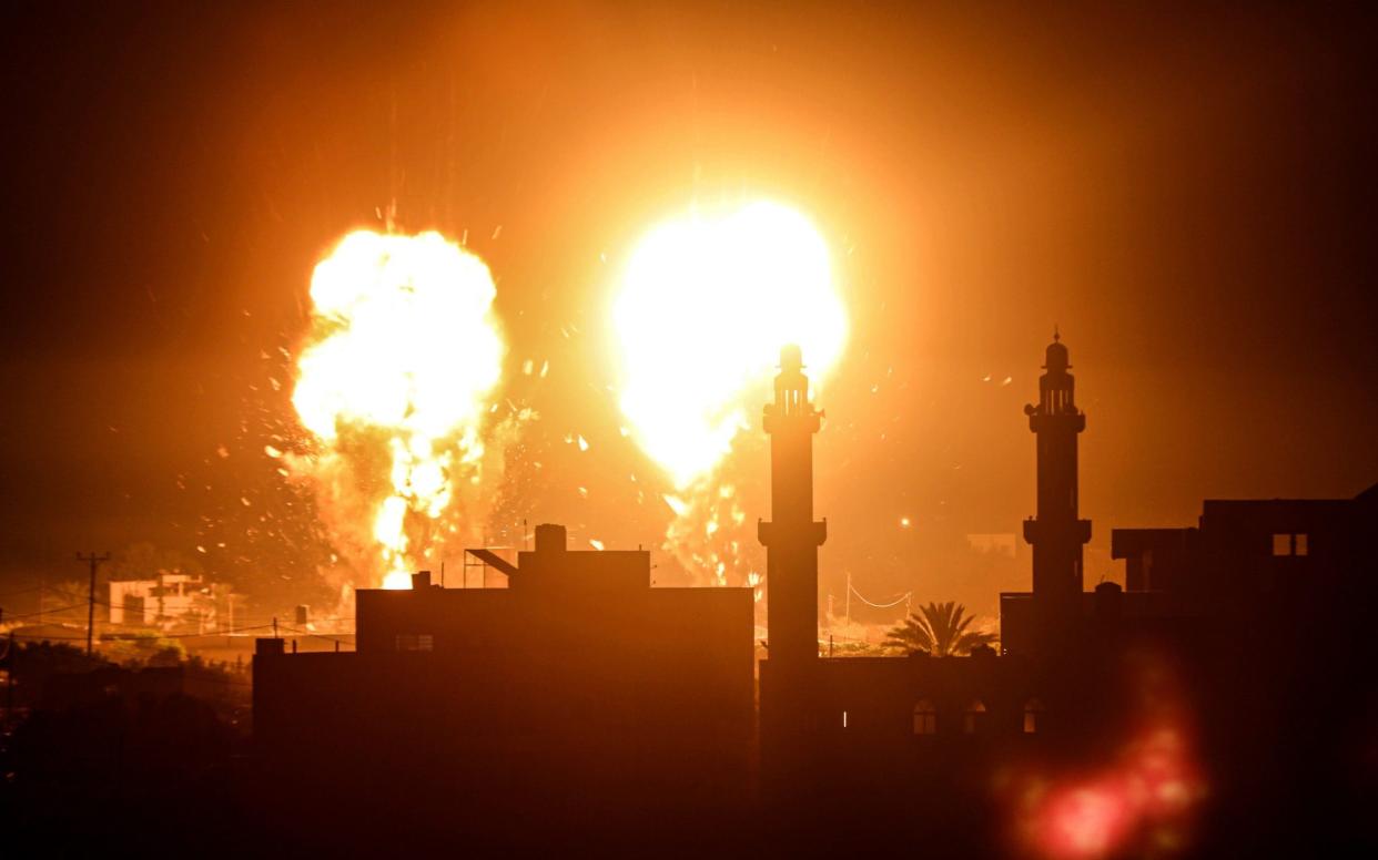 Flames are seen after an Israeli air strike hit Hamas targets in Gaza City,  - Anadolu