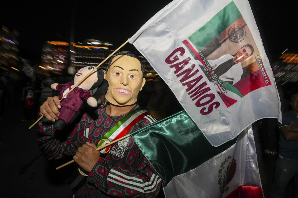 A supporter of ruling party presidential candidate Claudia Sheinbaum holds a flag that reads in Spanish "we won" after general elections at the Zocalo, Mexico City's main square, Sunday, June 2, 2024. (AP Photo/Matias Delacroix)