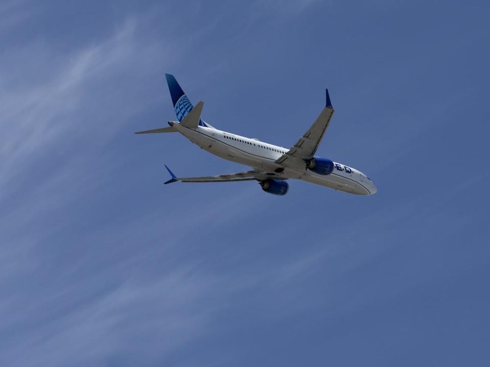 A United Airlines plane flying