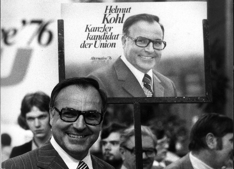 <p>Helmut Kohl stands in front of an election poster during an election campaign for the West German 1976 general election on June. 26, 1975. (Reuters) </p>