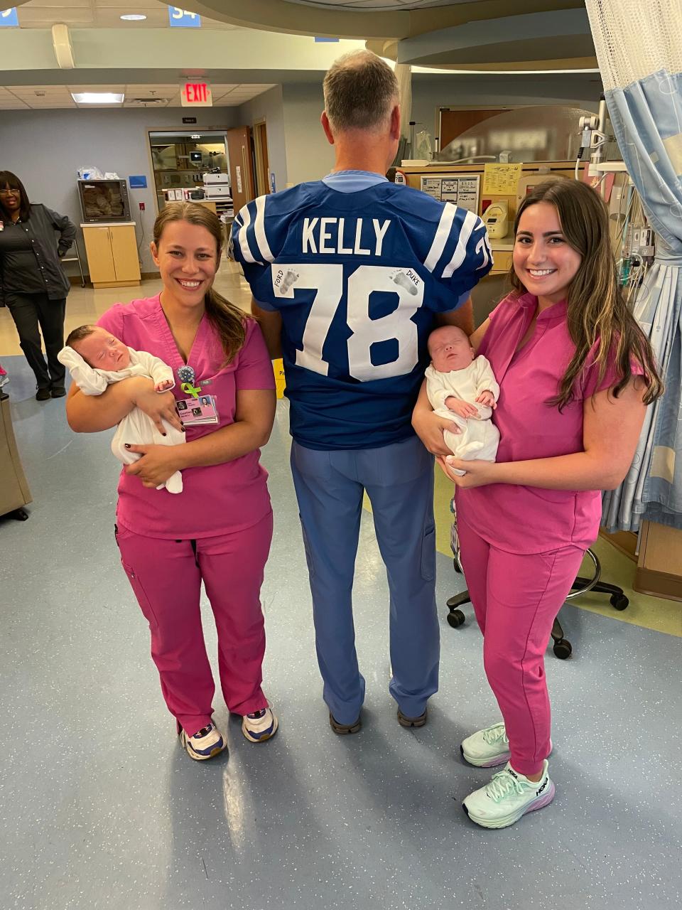 Dr. Kendall Graham shows off the Ryan Kelly Colts jersey the Kellys gave to him with footprints of Ford and Duke on each number.