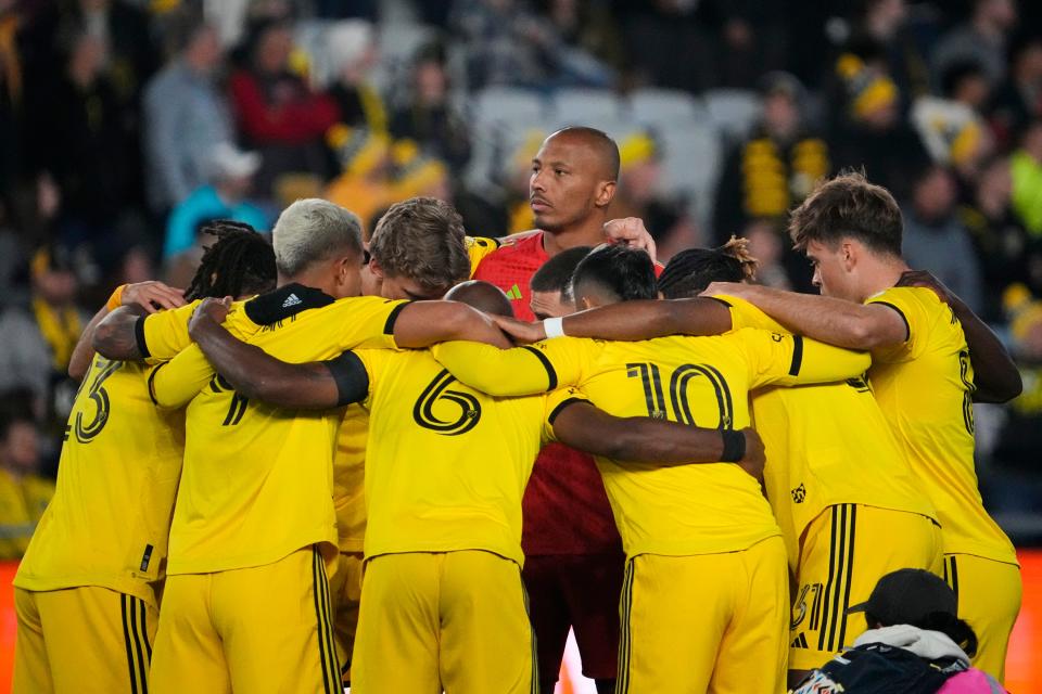 Crew goalkeeper Eloy Room, here standing in the middle of the huddle prior to the home opener March 4 against D.C. United is 1-1-1 in three starts this season