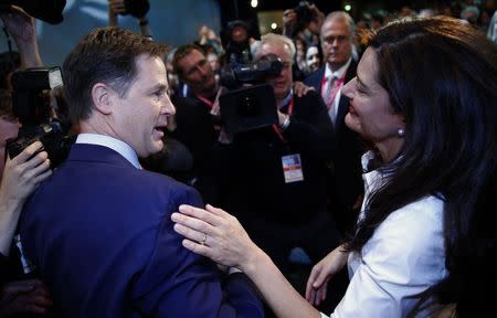 Britain's Deputy Prime Minister, and leader of the Liberal Democrats, Nick Clegg embraces his wife Miriam Gonzalez Durantez, after delivering his keynote speech at the party's autumn conference in Glasgow, Scotland October 8, 2014. REUTERS/Russell Cheyne