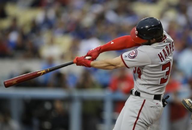 Bryce Harper swings so hard he rips the cover off this ball