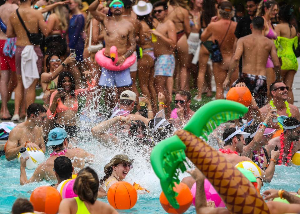 Lisa Considine of San Diego splashes in the pool with fellow festivalgoers during Splash House at the Saguaro in Palm Springs, Calif., Saturday, June 10, 2023. 