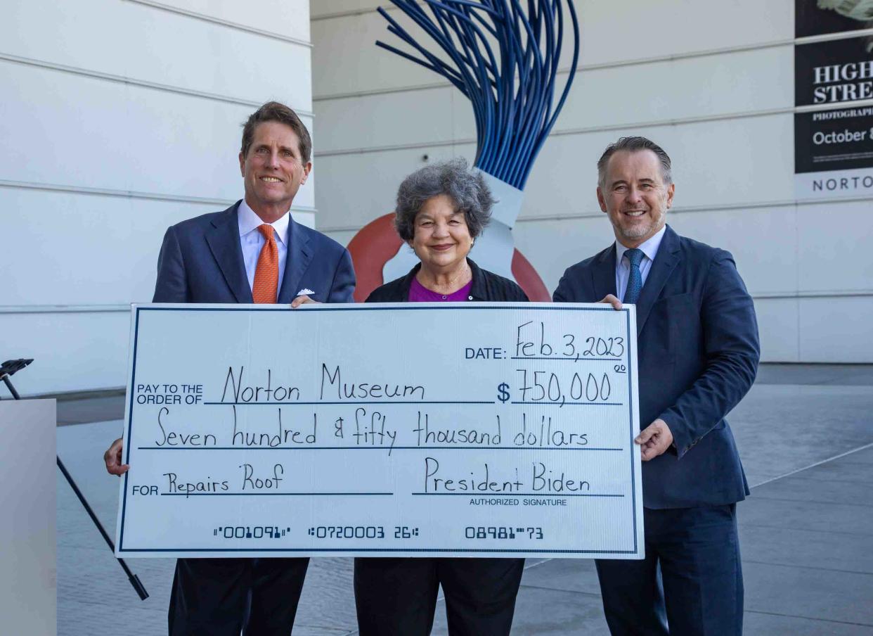 Bruce Gendelman, chairman of the Norton Museum's board, from left; U.S. Rep. Lois Frankel; and the museum's Director and CEO Ghislain d’Humières hold a check from the federal government for $750,000.