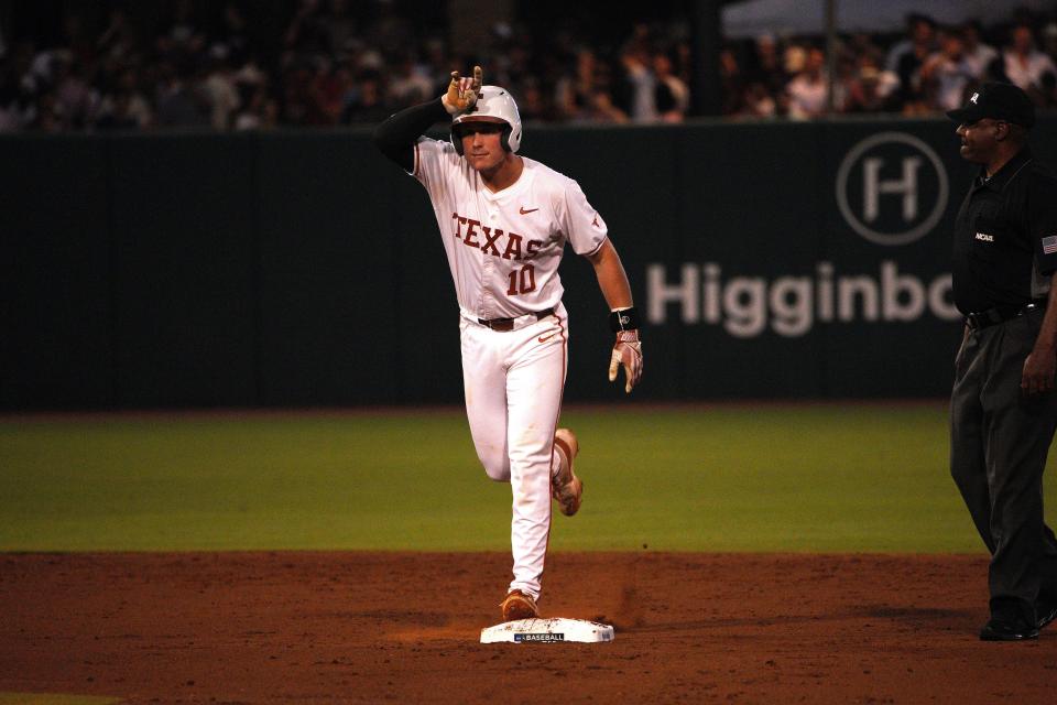 Texas Longhorns catcher Kimble Schuessler (10) celebrates a double against the Texas A&M Aggies during the second round in the NCAA baseball College Station Regional at Olsen Field College Station.