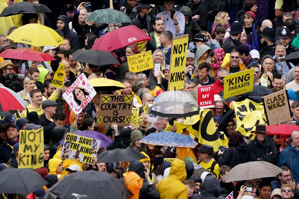 Protesters hold up placards saying 'Not My King' in Trafalgar Square close to where Britain's King Charles III and Britain's Camilla, Queen Consort will be crowned at Westminster Abbey in central London on May 6, 2023. - The set-piece coronation is the first in Britain in 70 years, and only the second in history to be televised. Charles will be the 40th reigning monarch to be crowned at the central London church since King William I in 1066. Republican opponents who want an elected head of state plan to protest on the day with signs declaring "Not my king". (Photo by Gareth Fuller / POOL / AFP) (Photo by GARETH FULLER/POOL/AFP via Getty Images)