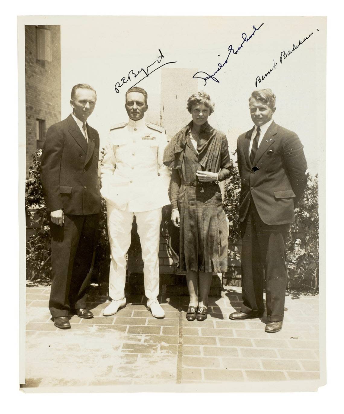A photo of Amelia Earhart with explorers R.E. Byrd, second from left, and Bernt Balchen, far right, will be auctioned along with other Earhart photos. Courtesy Bonhams