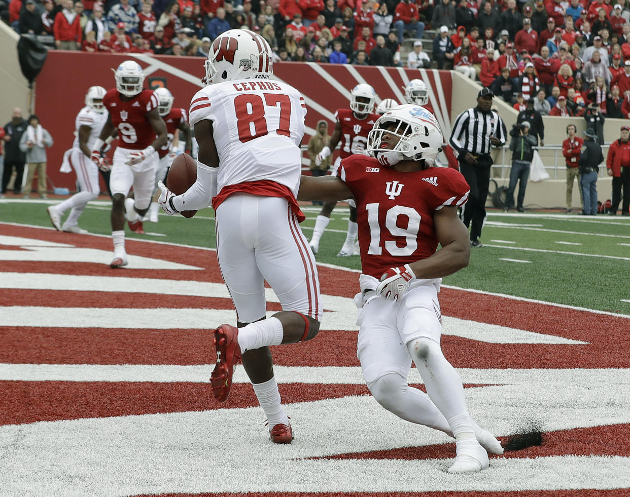 Wisconsin wide receiver Quintez Cephus (87) makes an eight yard touchdown reception against Indiana’s Tony Fields (19) during the first half of an NCAA college football game, Saturday, Nov. 4, 2017, in Bloomington, Ind. (AP Photo/Darron Cummings)