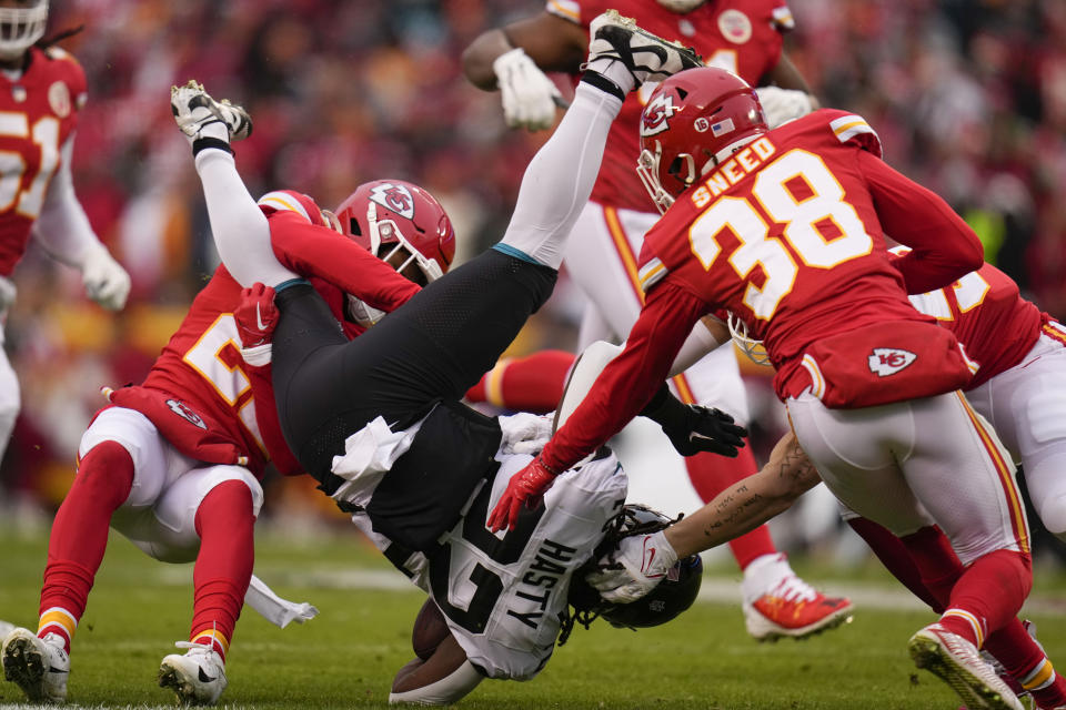 Jacksonville Jaguars running back JaMycal Hasty (22) is hit by Kansas City Chiefs cornerback L'Jarius Sneed (38) during the first half of an NFL divisional round playoff football game, Saturday, Jan. 21, 2023, in Kansas City, Mo. (AP Photo/Jeff Roberson)