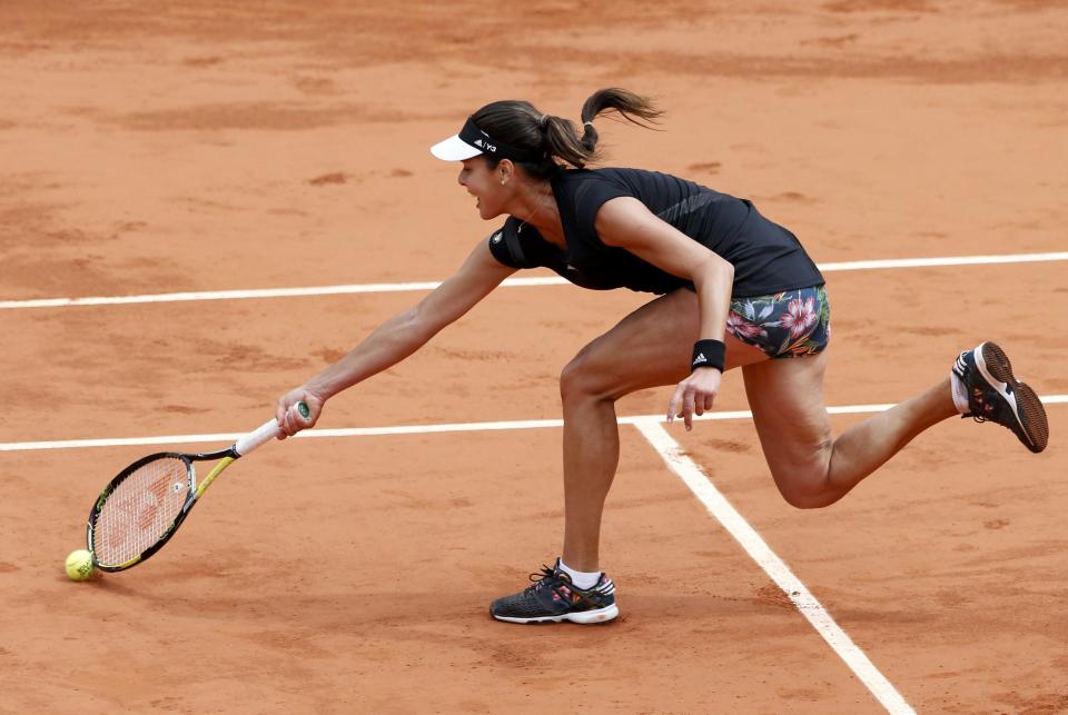 Ana Ivanovic of Serbia returns the ball to Elina Svitolina of Ukraine during their women's quarter-final match during the French Open tennis tournament at the Roland Garros stadium in Paris