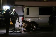 German special forces prepare to search an area after a shooting in Hanau near Frankfurt