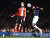 Luton Town's Luke Berry and Brentford's Ethan Pinnock, right, battle for the ball during the English Premier League soccer match between Brentford FC and Luton Town at Kenilworth Road stadium, in Luton, England, Saturday April 20, 2024. (John Walton/PA via AP)