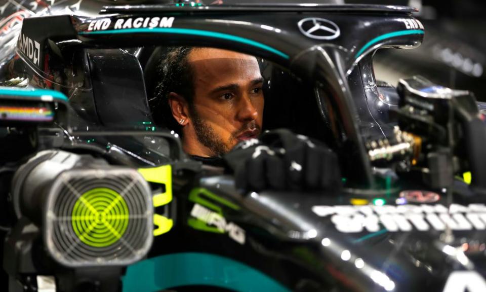 Lewis Hamilton looks reserved after his victory beneath his car’s halo