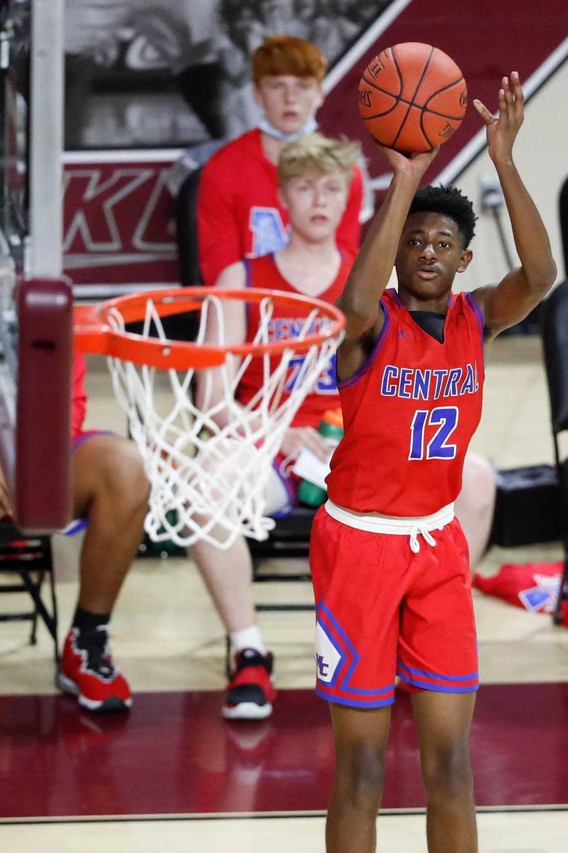 Madison Central’s Jaylen Davis (12) shoots over Franklin County defenders during the boys’ 11th Region tournament semifinals at EKU on March 25, 2021.