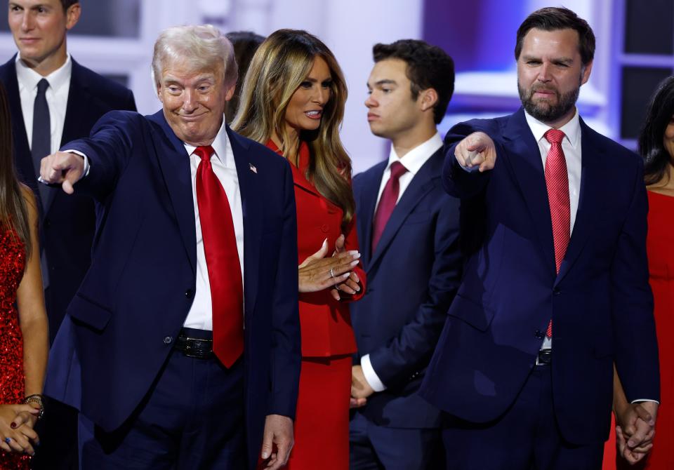 Republican presidential candidate, former U.S. President Donald Trump (L) and Republican vice presidential candidate, U.S. Sen. J.D. Vance (R-OH) on stage at the end of the fourth day of the Republican National Convention at the Fiserv Forum on July 18, 2024 in Milwaukee, Wisconsin.