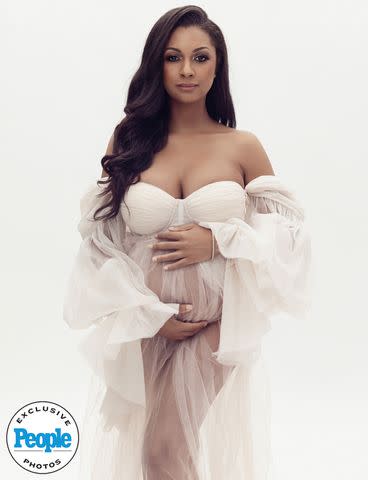 <p>Lola Melani Photography</p> Eboni K. Williams will welcome her first baby, a daughter, this August