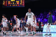 In this photo provided by Bahamas Visual Services, Michigan State forward Gabe Brown (44) and teammates celebrate after defeating Connecticut 64-60 in an NCAA college basketball game at Paradise Island, Bahamas, Thursday, Nov. 25, 2021. (Tim Aylen/Bahamas Visual Services via AP)