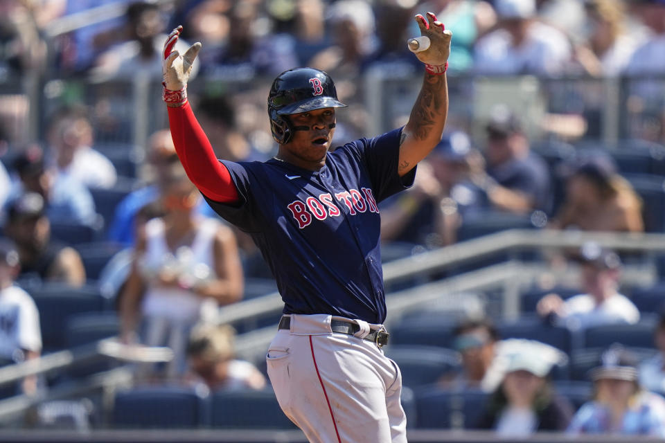 Boston Red Sox's Rafael Devers gestures to teammates after hitting a single during the third inning of a baseball game against the New York Yankees, Sunday, Aug. 20, 2023, in New York. (AP Photo/Frank Franklin II)