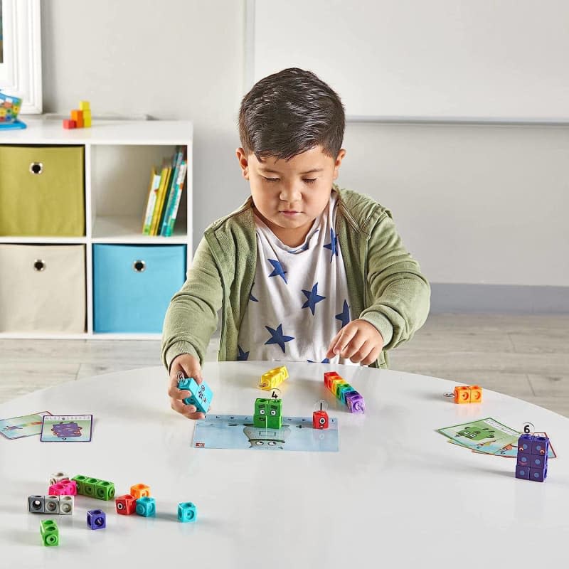 boy playing with buildable colorful tiles