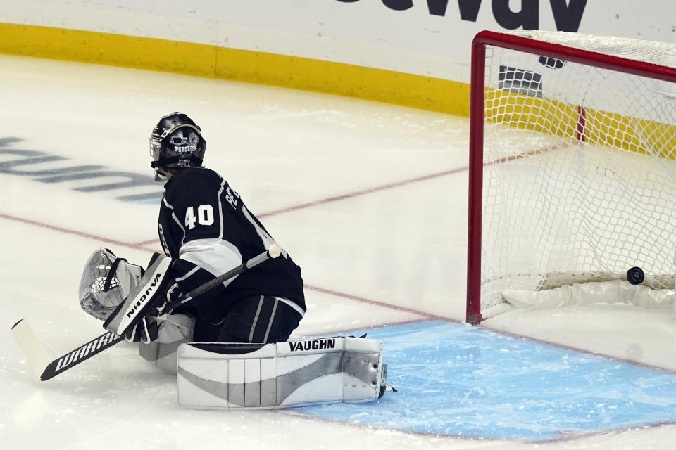 Los Angeles Kings goaltender Calvin Petersen gives up a goal on a shot from St. Louis Blues' David Perron during the first period of an NHL hockey game Friday, March 5, 2021, in Los Angeles. (AP Photo/Marcio Jose Sanchez)