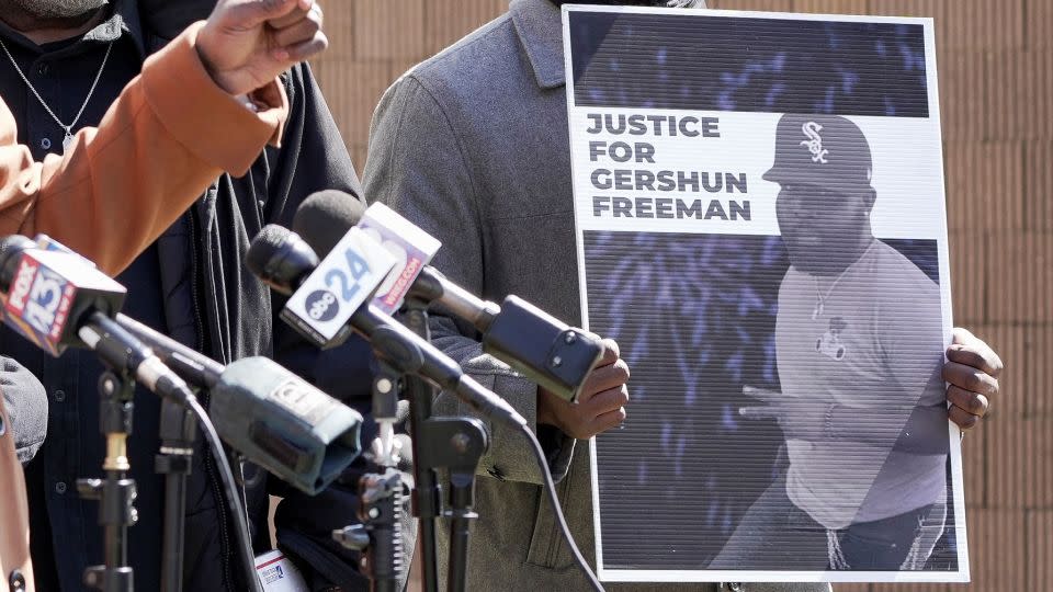 A sign demanding justice for Gershun Freeman is held up at a family news conference in March. - Karen Pulfer Focht/Reuters