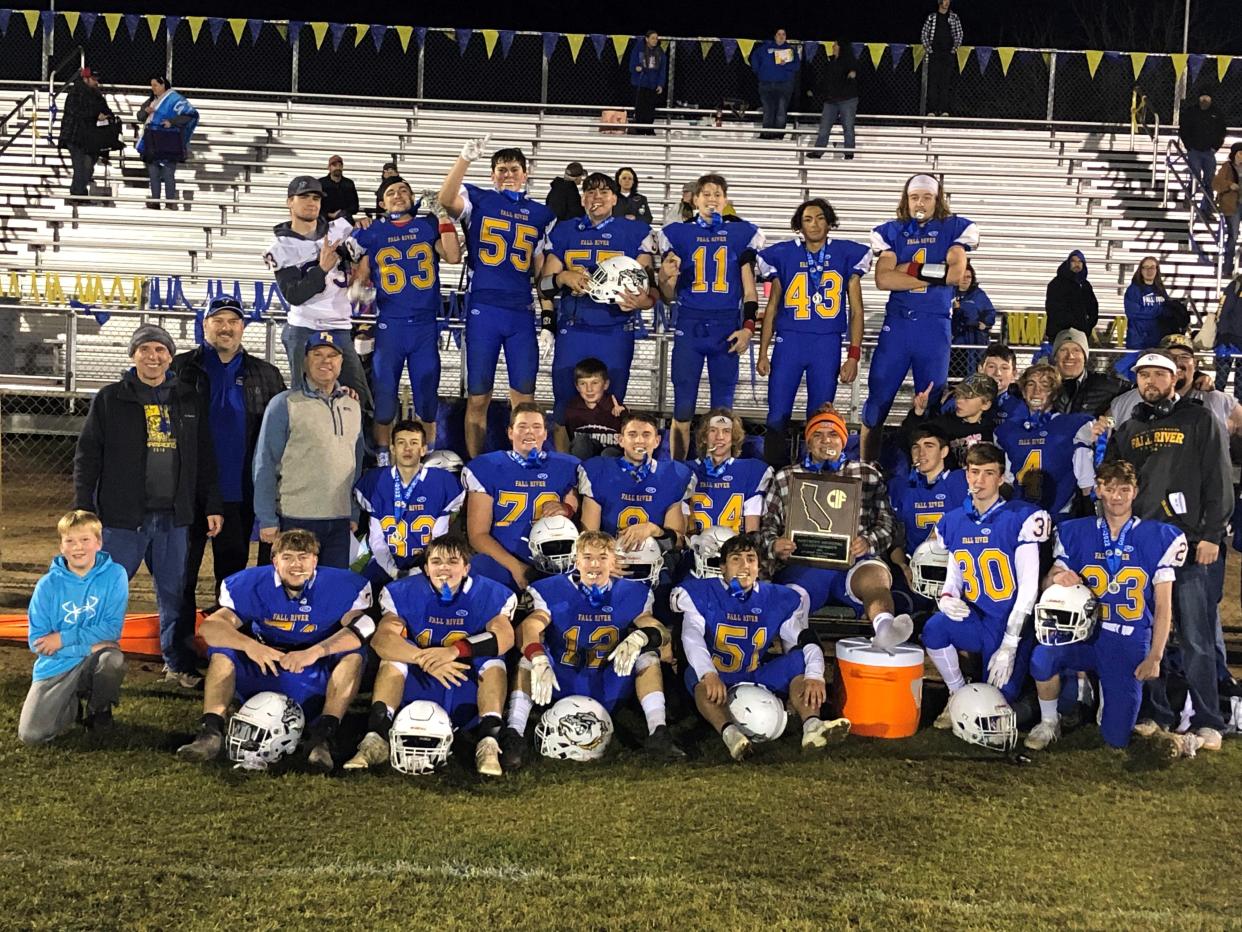 Fall River poses with their trophy after defeating Le Grand 42-21 in the CIF Northern Regional Division 7-AA championship at Fall River High School on Saturday, Dec. 4, 2021.