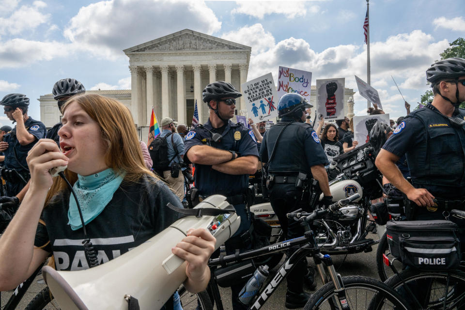 Demonstrators protest in front of the U.S. Supreme Court moments before the Dobbs v Jackson Women's Health Organization ruling on June 24, 2022 in Washington, DC.  / Credit: BRANDON BELL / Getty Images
