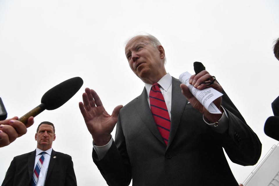 President Biden speaks to reporters at Joint Base Andrews in Maryland on Tuesday. (Photo by Nicholas Kamm/AFP via Getty Images)