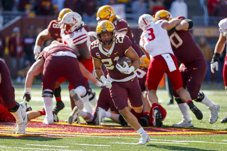 Minnesota running back Bryce Williams (21) gets away from the pack and runs for a touchdown against Nebraska in the fourth quarter of an NCAA college football game Saturday, Oct. 16, 2021, in Minneapolis. Minnesota won 30-23. (AP Photo/Bruce Kluckhohn)