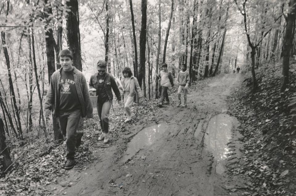 Jeff Coning and Sandy Norse lead campers down the trail and back to camp at Camp Ohio, a 4-H camp that hosted its first campers in 1928.