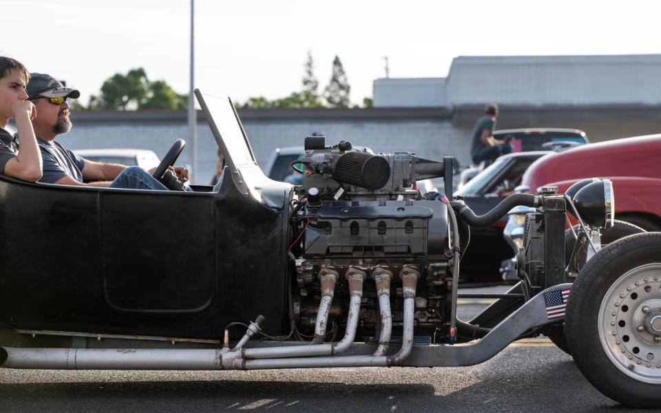 Classic car owners cruise down McHenry Avenue during the Graffiti Parade in Modesto, Calif., Friday, June 9, 2023. Andy Alfaro/aalfaro@modbee.com