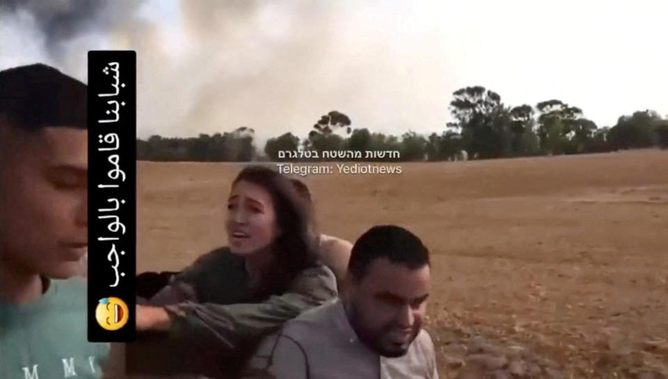 A screengrab from a social media video published on October 7, 2023, shows Noa Argamani as she is taken hostage by Palestinian militants. / Credit: Video obtained by Reuters