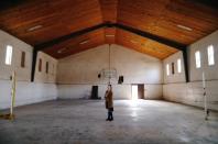 Kendra Miller shows the old basketball court where she used to play as a kid in La Mora