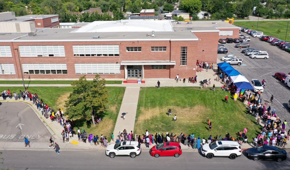 People line up for Refugee Back to School Night at Granite Park Junior High in South Salt Lake on Monday, Aug. 7, 2023. | Kristin Murphy, Deseret News