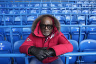 Former Chelsea soccer player Paul Canoville poses for a portrait during an interview with the Associated Press at Chelsea's Stamford Bridge ground in London, Thursday, March 2, 2023. The manifestation of a deeper societal problem, racism is a decades-old issue in soccer — predominantly in Europe but seen all around the world — that has been amplified by the reach of social media and a growing willingness for people to call it out. (AP Photo/Alastair Grant)