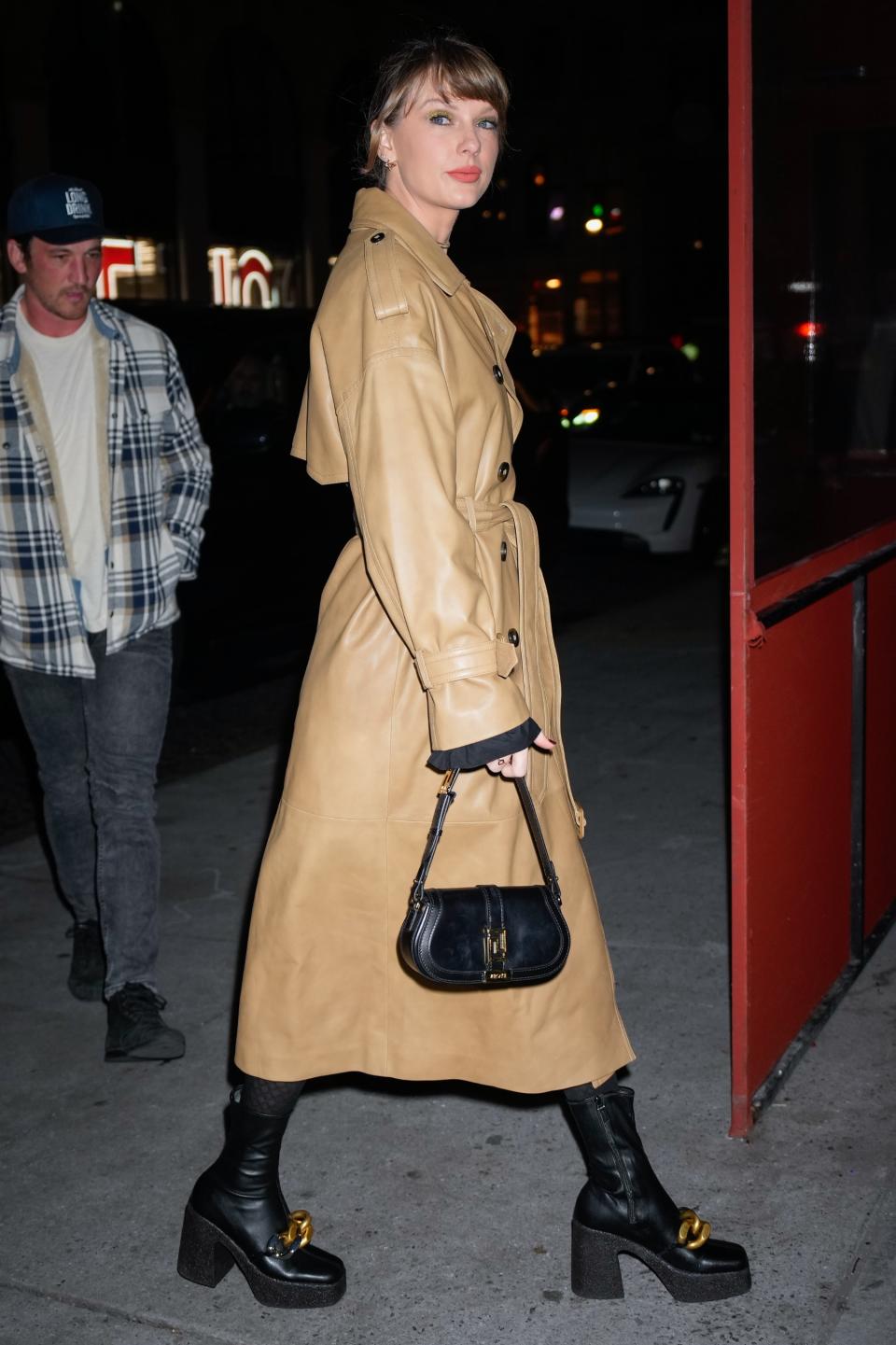 Taylor Swift, Stella McCartney, boots, black boots, womens boots, platforms, platform boots, platform heels, block heels, chain boots, chains, chain shoes, footwear, womens footwear, vegan heels, vegan boots, Versace, handbag, tights, trench coat, leather coat, birthday, New York City