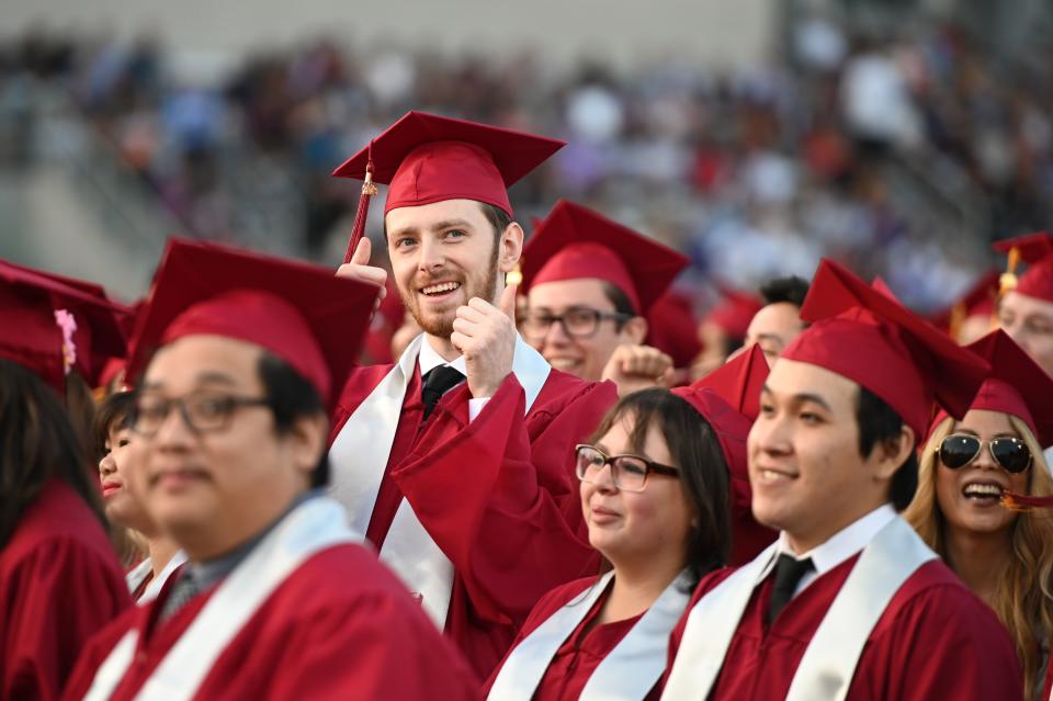 Students earning degrees at Pasadena City College participate in the graduation ceremony, June 14, 2019, in Pasadena, California. - With 45 million borrowers owing $1.5 trillion, the student debt crisis in the United States has exploded in recent years and has become a key electoral issue in the run-up to the 2020 presidential elections. "Somebody who graduates from a public university this year is expected to have over $35,000 in student loan debt on average," said Cody Hounanian, program director of Student Debt Crisis, a California NGO that assists students and is fighting for reforms. (Photo by Robyn Beck / AFP)        (Photo credit should read ROBYN BECK/AFP via Getty Images)