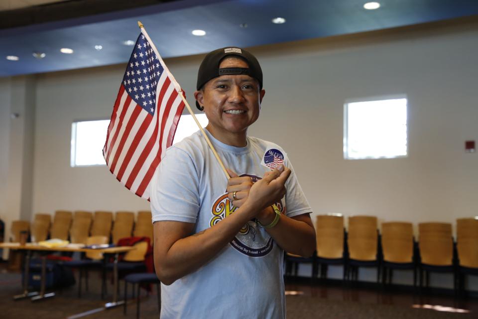 Travis J. Begay holds an "I voted" sticker written in the Navajo language after voting at the Farmington Public Library in the 2022 New Mexico Primary Election on June 7.