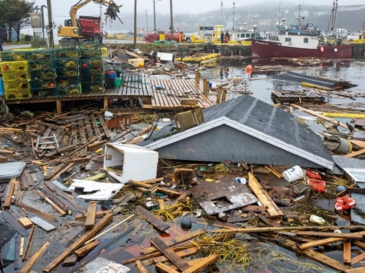 The report from Christian Aid estimates Fiona, which bulldozed across Atlantic Canada as a post-tropical storm in September, cost nearly $4 billion in damages.  (Frank Gunn/The Canadian Press - image credit)