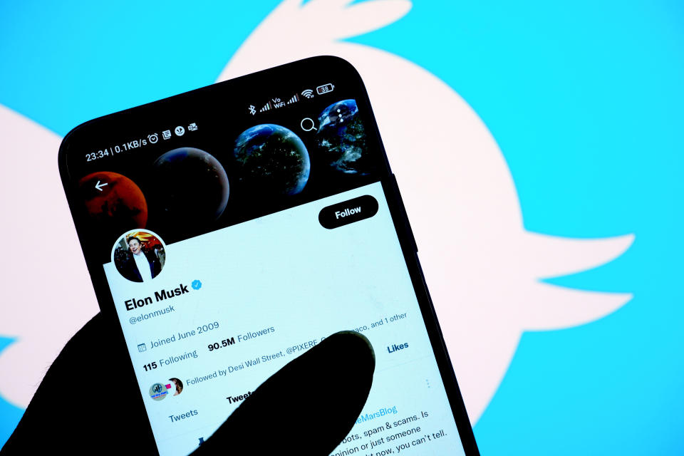 INDIA - 2022/05/03: In this photo illustration, Elon Musk Official Twitter account is seen displayed on a smartphone with a Twitter logo in the background. (Photo Illustration by Avishek Das/SOPA Images/LightRocket via Getty Images)