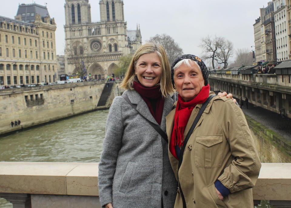 This December 2018 photo shows Lisa Hill, left, and her mother, Pat White, in Paris. Separated due to the coronavirus pandemic, Hill is gifting her mom a virtual cooking lesson for Mother’s Day. Isolation due to the coronavirus outbreak has led mothers and offspring to find creative ways to celebrate. (Sara Montgomery via AP)