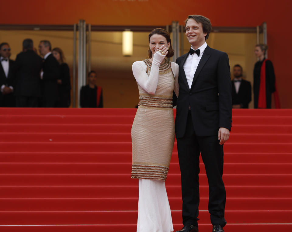Actors August Diehl, right, and Valerie Pachner pose for photographers upon arrival at the premiere of the film 'A Hidden Life' at the 72nd international film festival, Cannes, southern France, Sunday, May 19, 2019. (AP Photo/Petros Giannakouris)