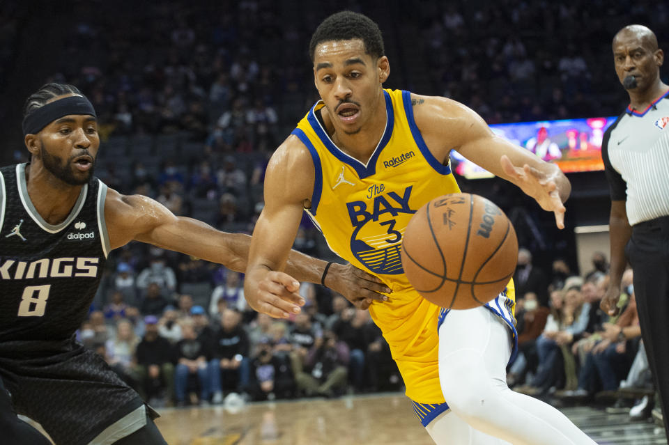 Sacramento Kings forward Maurice Harkless (8) guards against Golden State Warriors guard Jordan Poole (3) during the first quarter of an NBA basketball game in Sacramento, Calif., Sunday, Oct. 24, 2021. (AP Photo/Randall Benton)