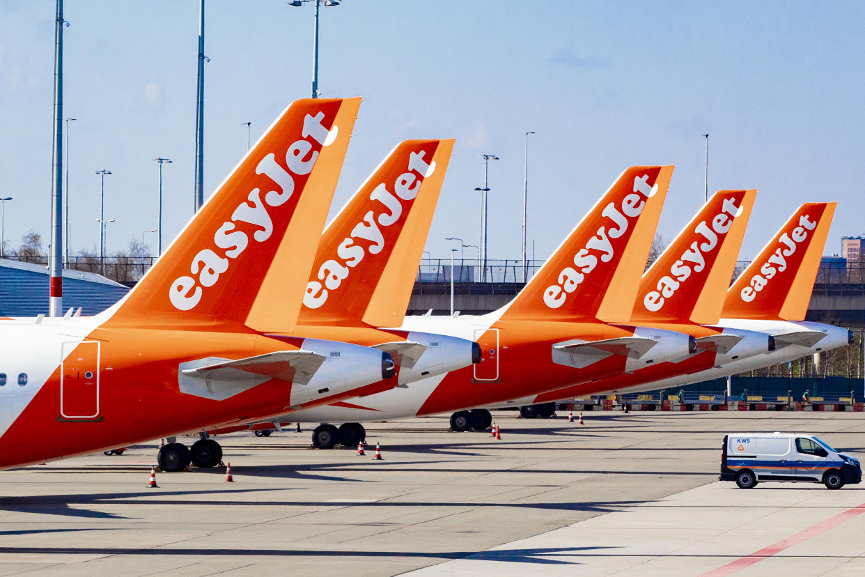 SCHIPHOL, NETHERLANDS - 2020/04/02: EasyJet aircrafts parked at an empty Schiphol Airport. Closed gates and departure halls at Schiphol airport during times of the coronavirus threats. The airport is shrinking what the airport itself calls Kern-Schiphol. This means that facilities for leaving passengers will continue in a slimmed-down form. (Photo by Niels Wenstedt/SOPA Images/LightRocket via Getty Images)