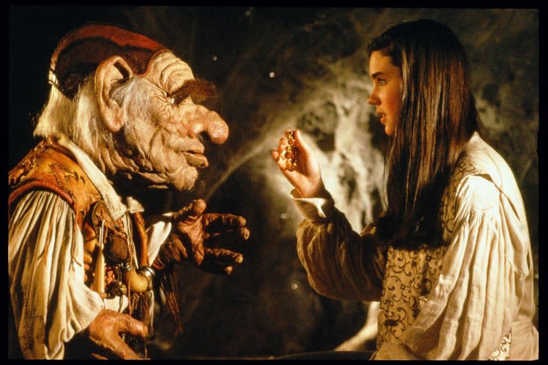 Hoggle (L) helps Sarah (Jennifer Connelly) through the labyrinth. Photo courtesy of Shout! Studios and The Jim Henson Company