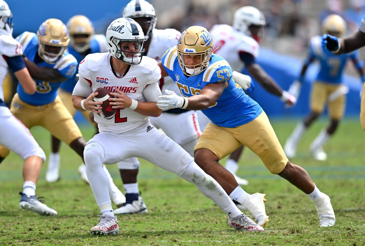 South Alabama quarterback Carter Bradley escapes a sack attempt by UCLA linebacker Darius Musau on Sept. 17. Texas State coach Jake Spavital, whose Bobcats will try to stop Bradley on Saturday, recruited the quarterback out of high school. “He does a lot of great things," Spavital said.
